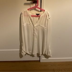 White blouse with gold accents